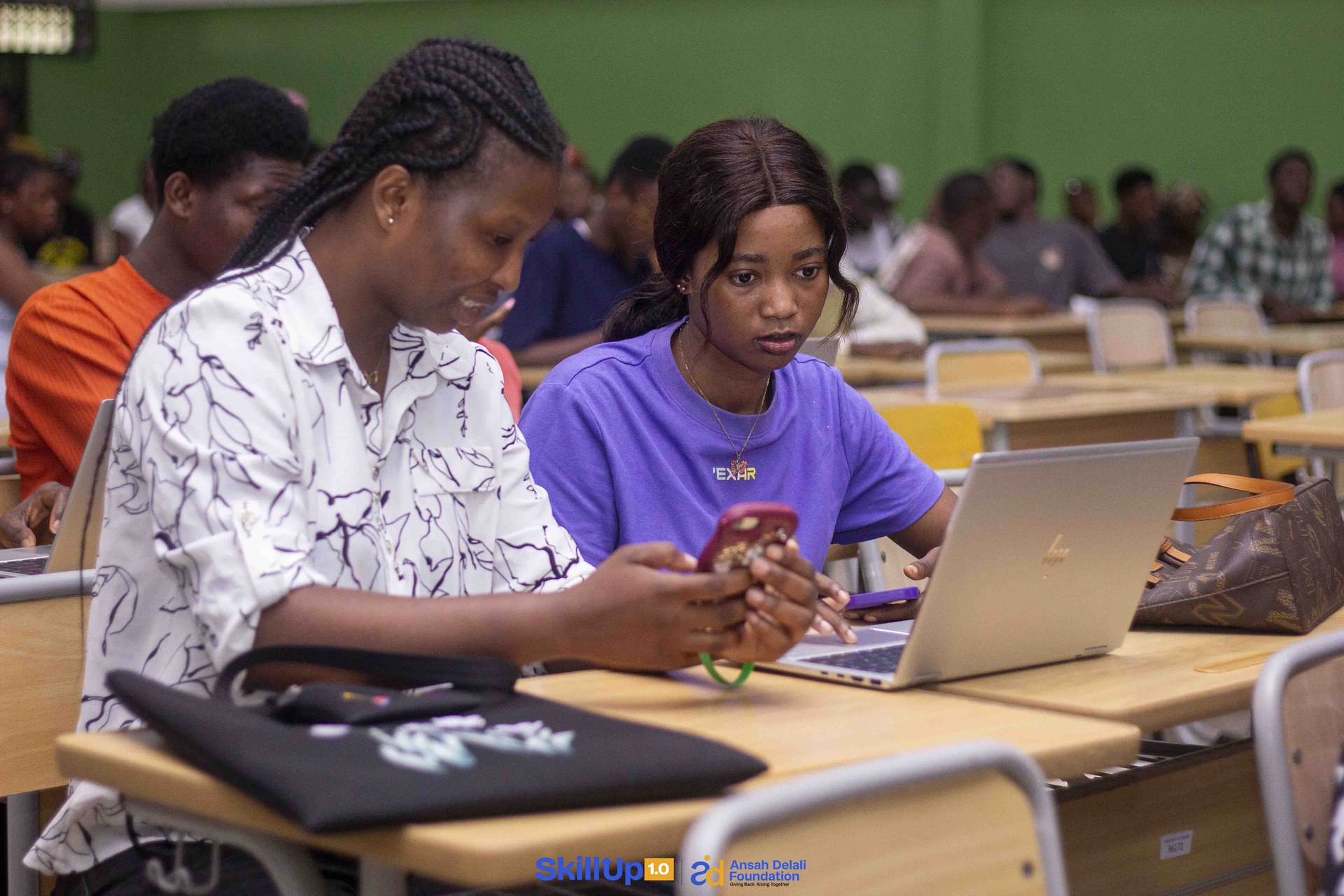 Students focused in lecture hall session